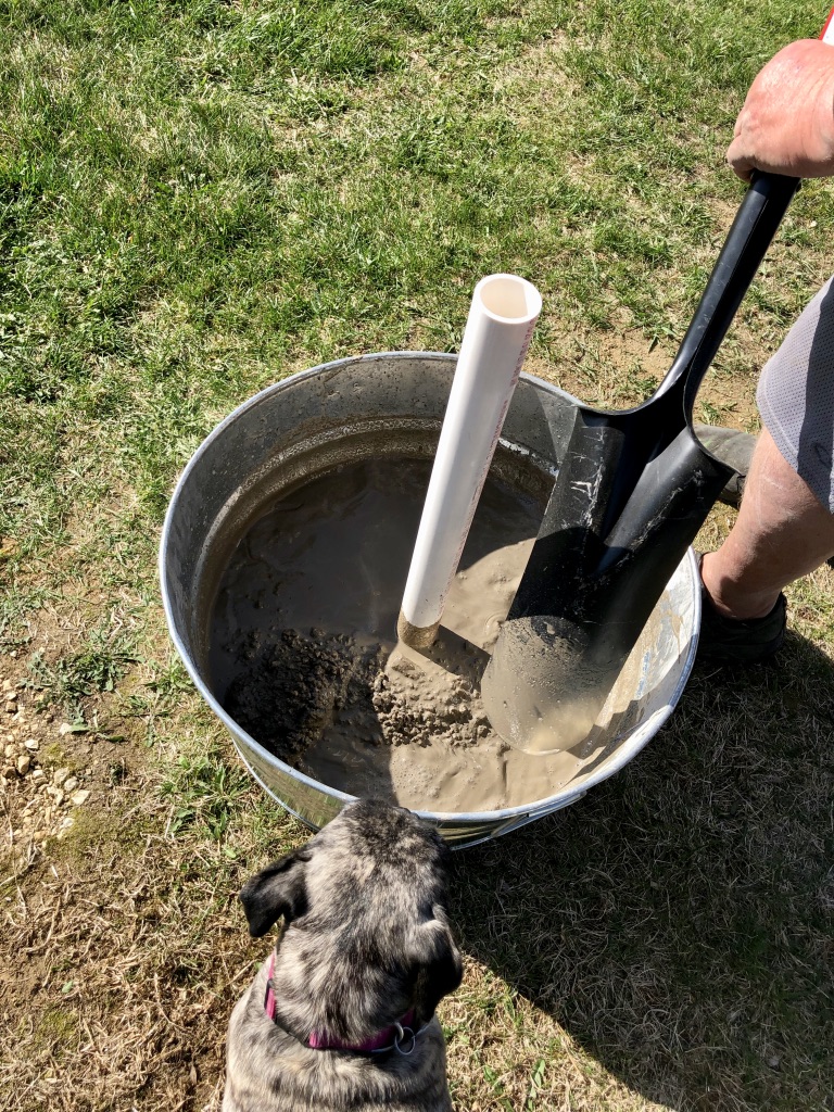 diy patio umbrella stand getting concrete mixed