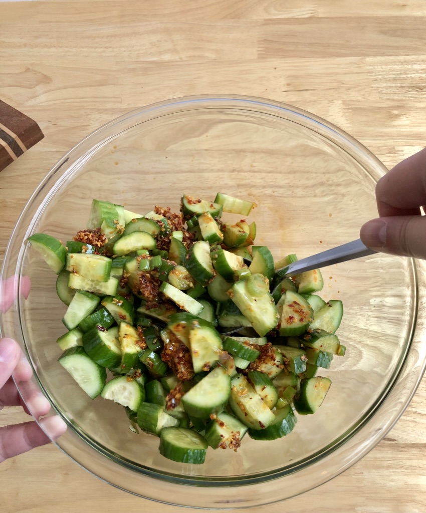 marinated cucumbers stirring